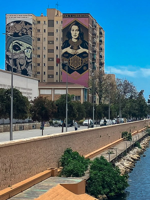Street Art "Cerrado por Malagueña" by D*Face and Paz Y Libertad from Shepard Farley (OBEY) next to the Guadalmedina river in Málaga, as part of the MAUS urban art project
