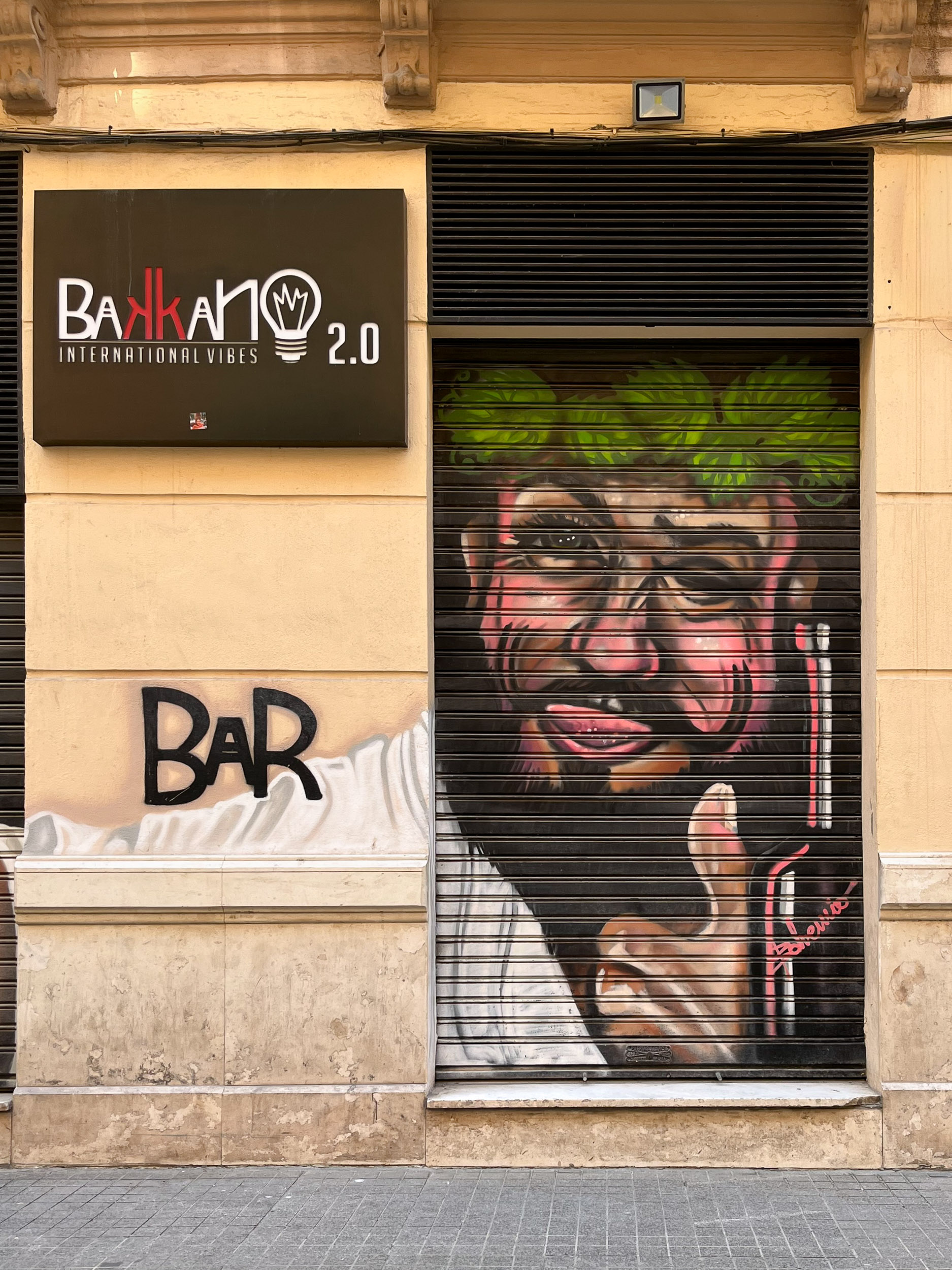 Bohemio mural on shutter of Bar Bakkano 2.0 Calle Hernán Ruiz Distrito Centro