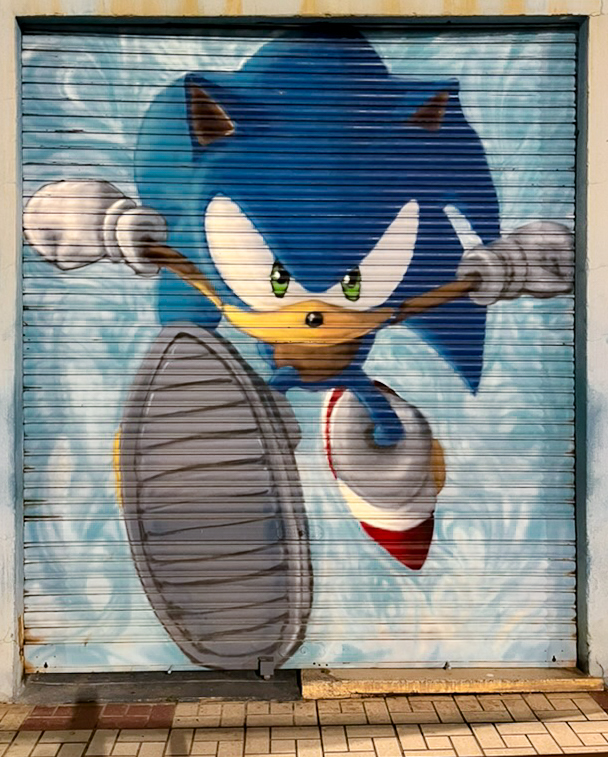Street art depiction of Sonic on a shop shutter in the Bailén-Miraflores district of Málaga