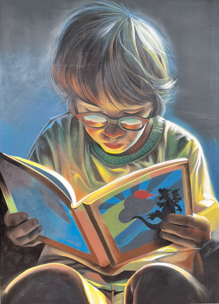 Mural by Lalone depicting a boy reading, on the wall of the El Divino Pastor school in the Tetuán district of Malaga