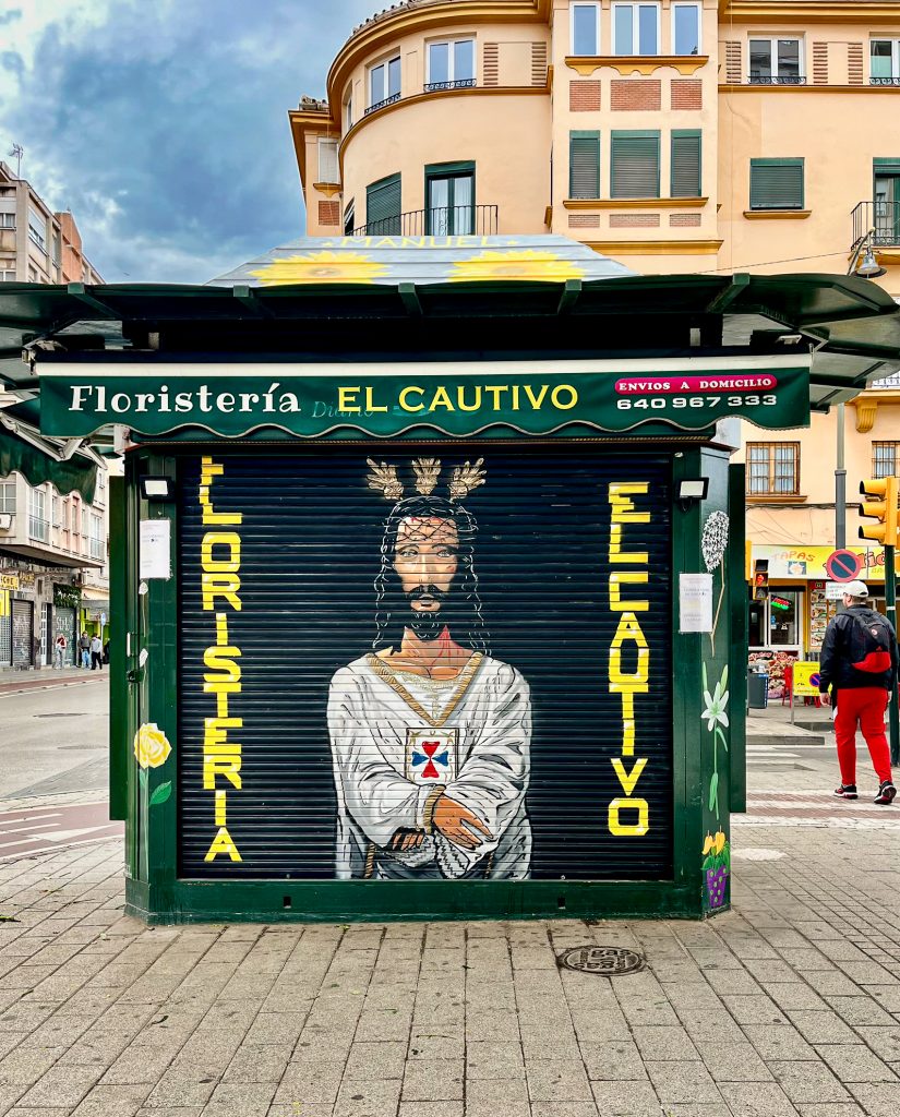 Jesus mural on the shutter of Floristería El Cautivo on Calle Mármoles in Málaga’s Centro district