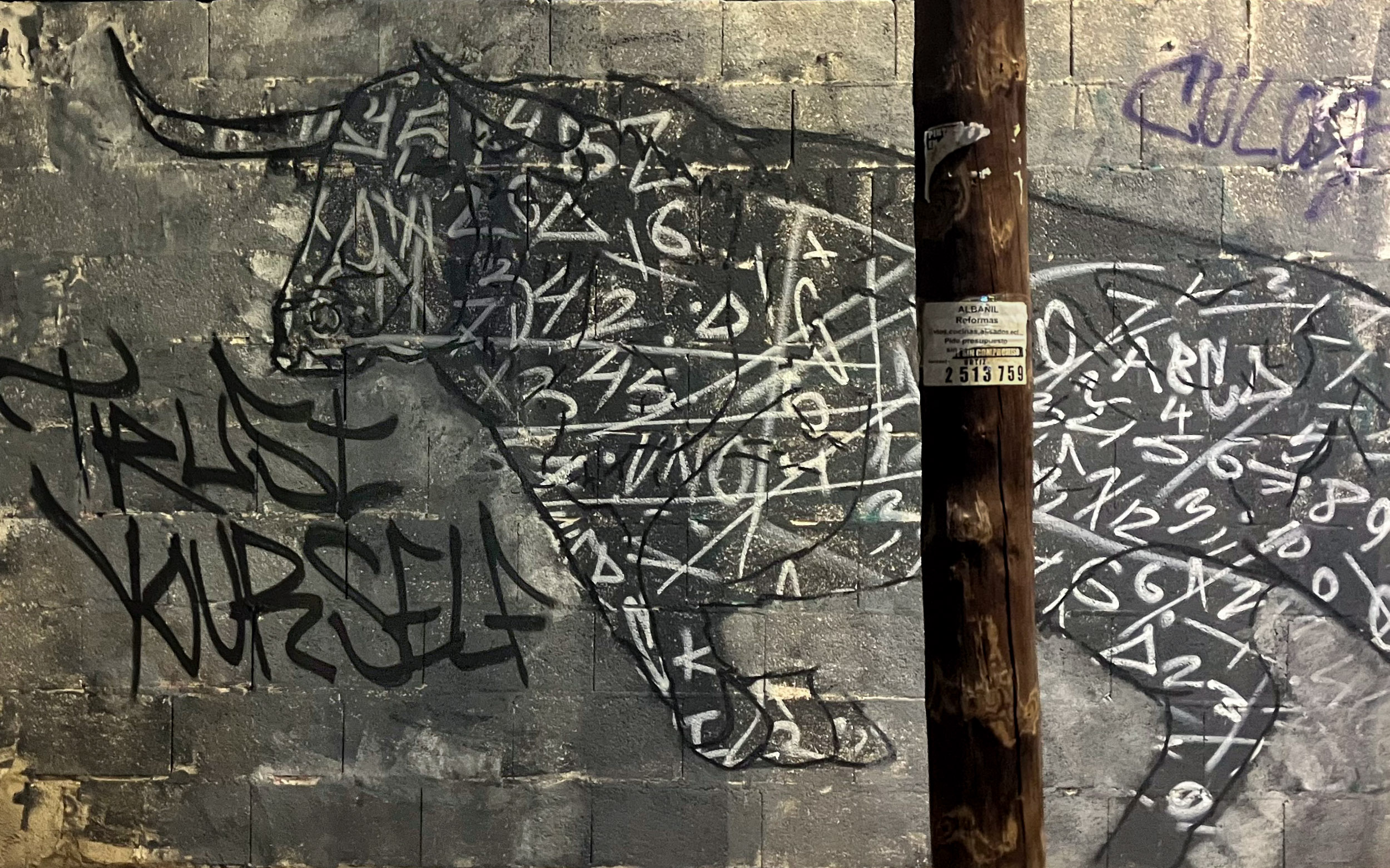 Street art of a bull titled "Trust Yourself"
