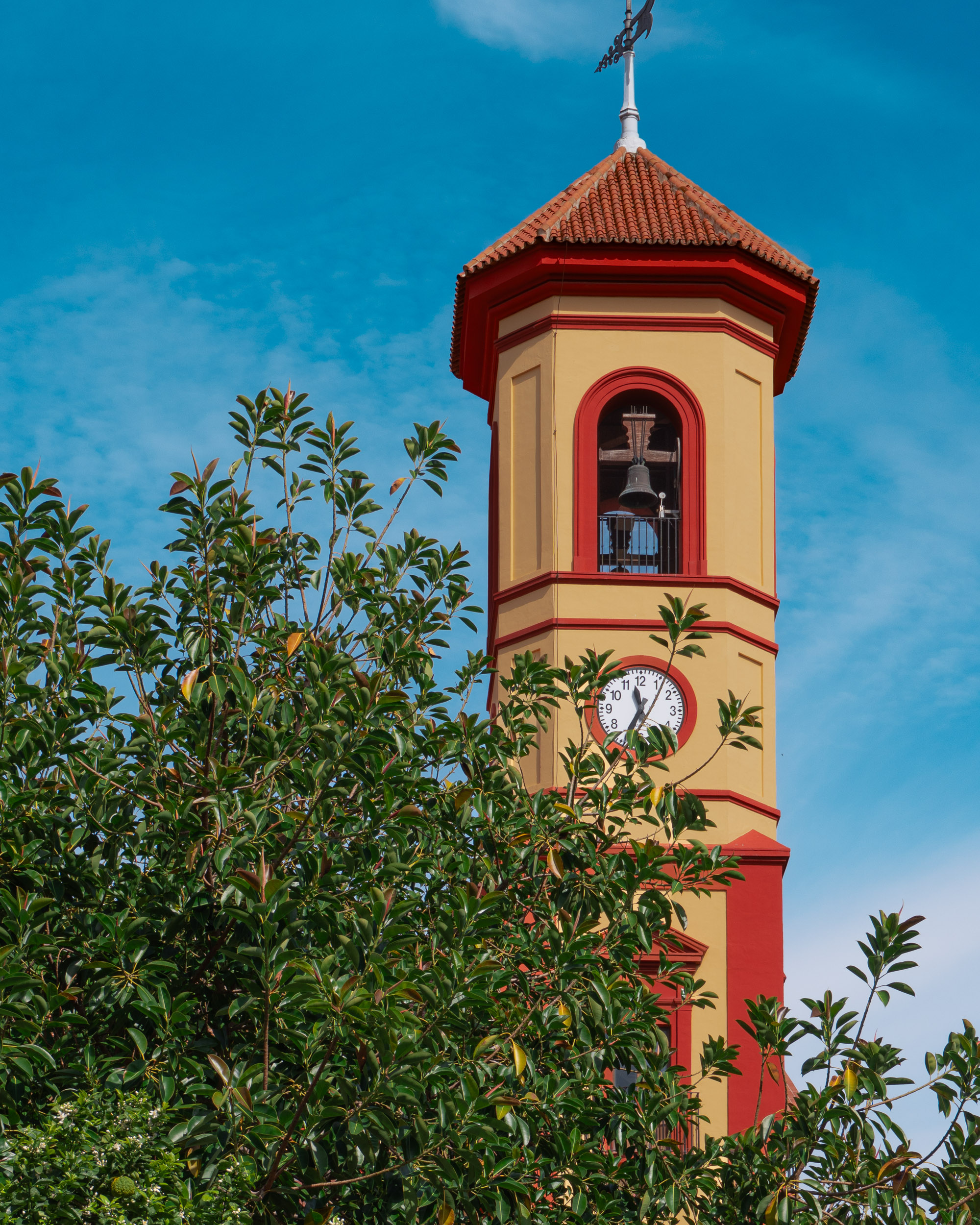 Tower of the San José Obrero church on Calle Virgen de las Nieves in Málaga's Cruz de Humilladero district