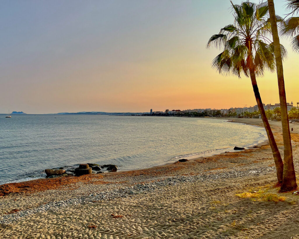 Estepona's La Rada beach at sunset with Gibraltar in the background