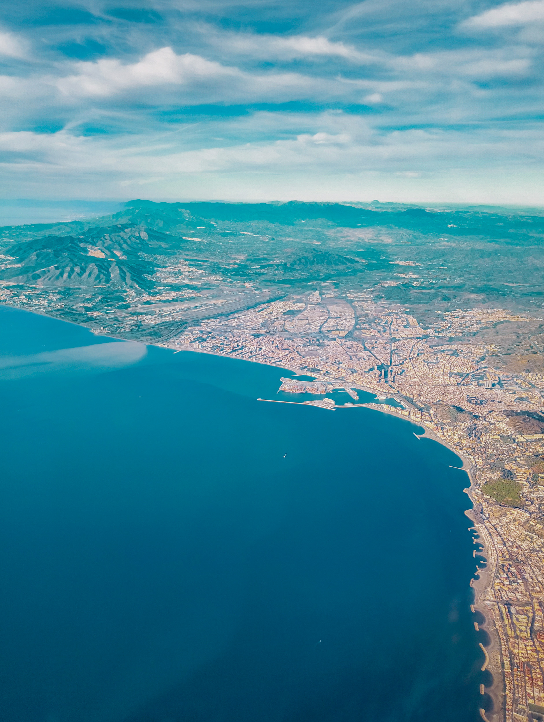 Aerial view of Málaga coast and the port of Málaga, shot from an airplane descending to the airport Málaga-Costa del Sol